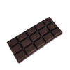 A dark brown, rectangular butter fidget stick with a grid pattern of squishy cells.