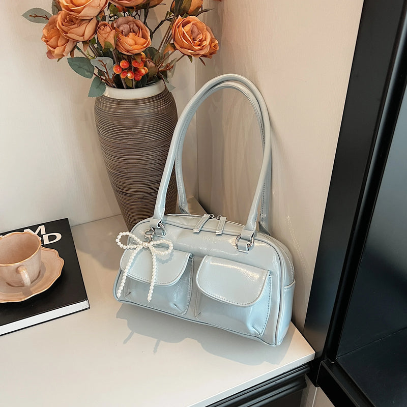 Bolso de hombro suave con detalle de lazo