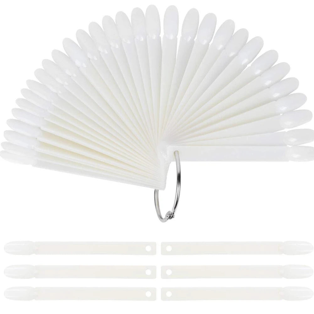 A fan-shaped set of clear acrylic false nail tips for practice and display.