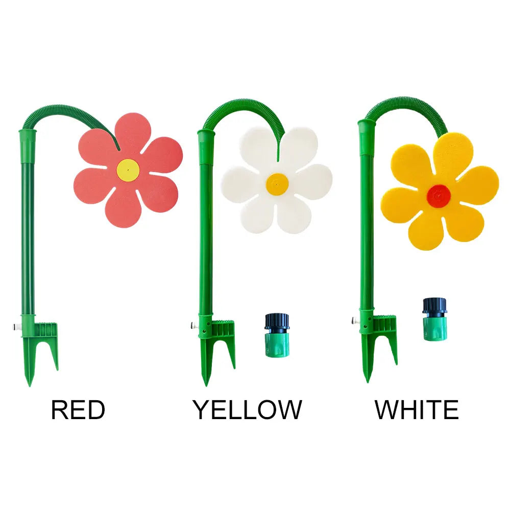 Trois arroseurs de jardin rouges, jaunes et blancs avec des bras verts et des têtes de fleurs.