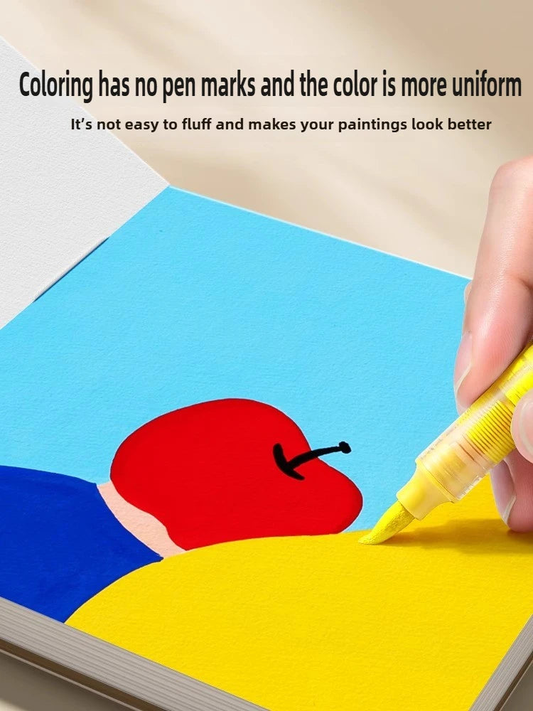 A hand is painting a colorful illustration on a blue paper surface with red and yellow colors.