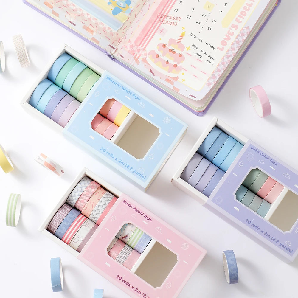 A collection of colorful washi tape rolls in various shades and patterns displayed on a white surface.