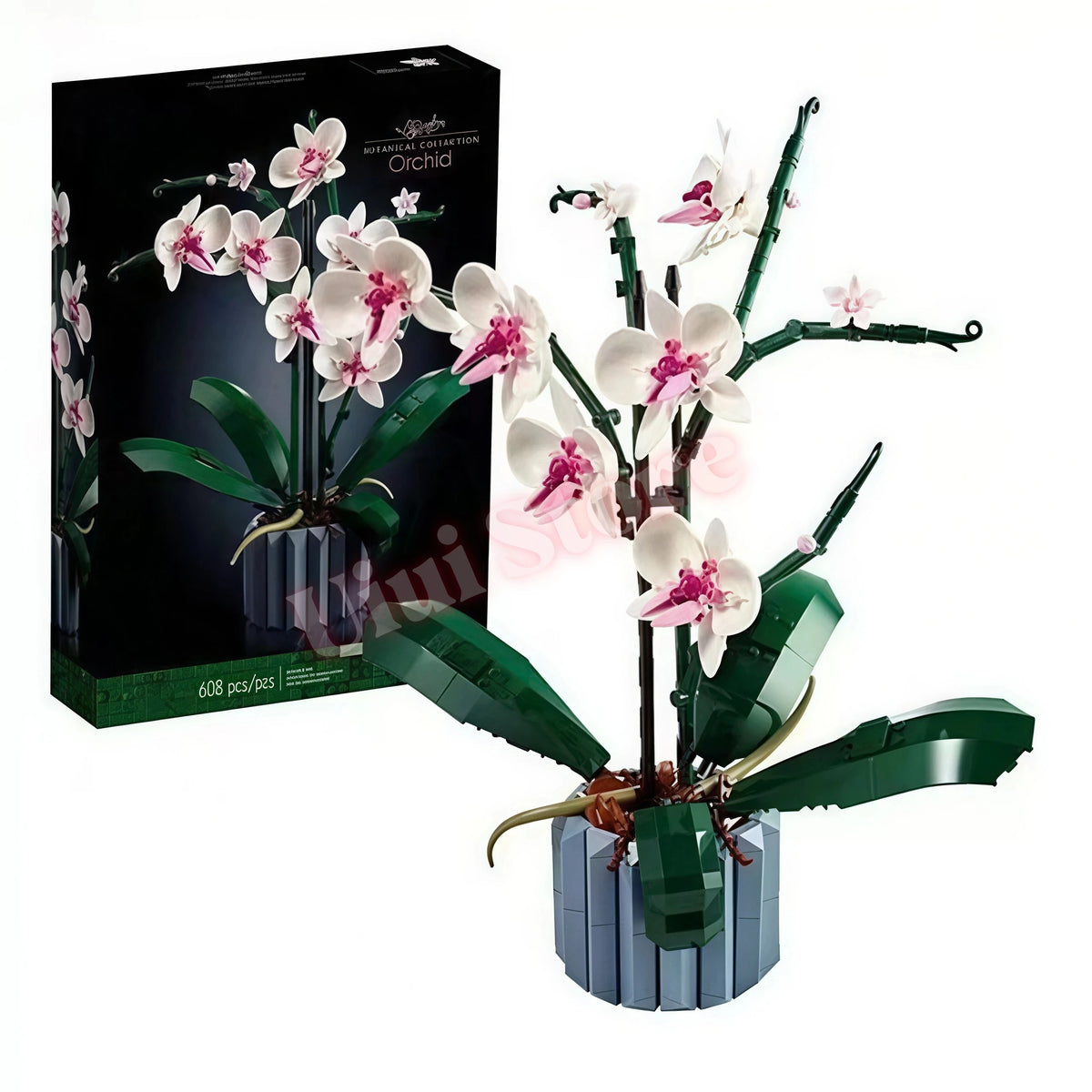 A box of Botanical Blooms building blocks featuring artificial orchid flowers and greenery.