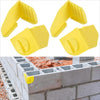 Two yellow masonry line corner clips with anti-slip locks shown against a brick wall.