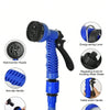 A blue expandable garden hose featuring a multi-function nozzle, non-slip handle, regulating knob, outlet switch, and durable