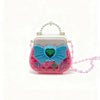 A pink and teal makeup toy set featuring a heart-shaped accessory and a white handle with pearl detailing.