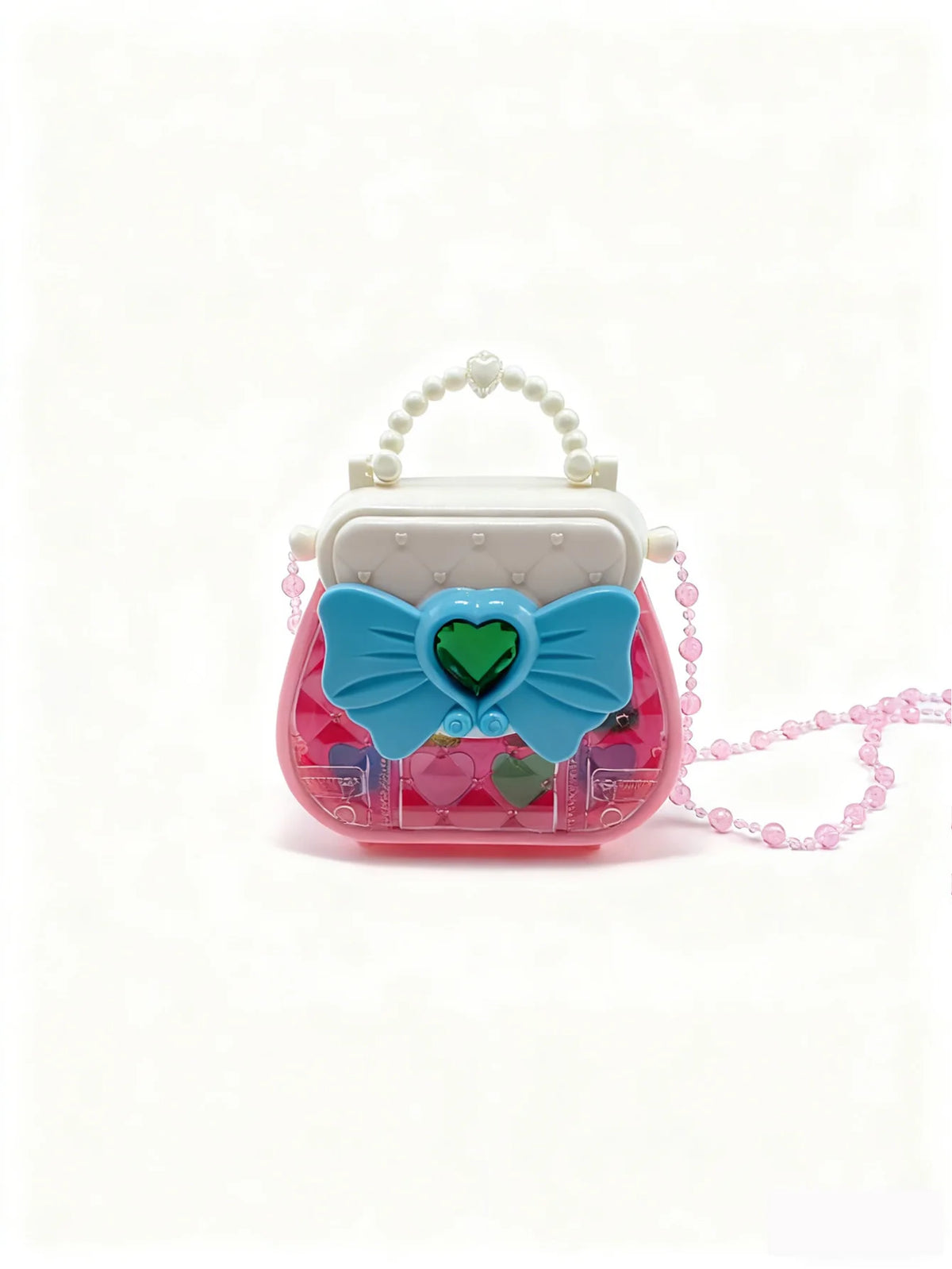 A pink and teal makeup toy set featuring a heart-shaped accessory and a white handle with pearl detailing.