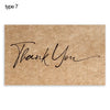 A brown kraft paper tag with the handwritten text Thank You