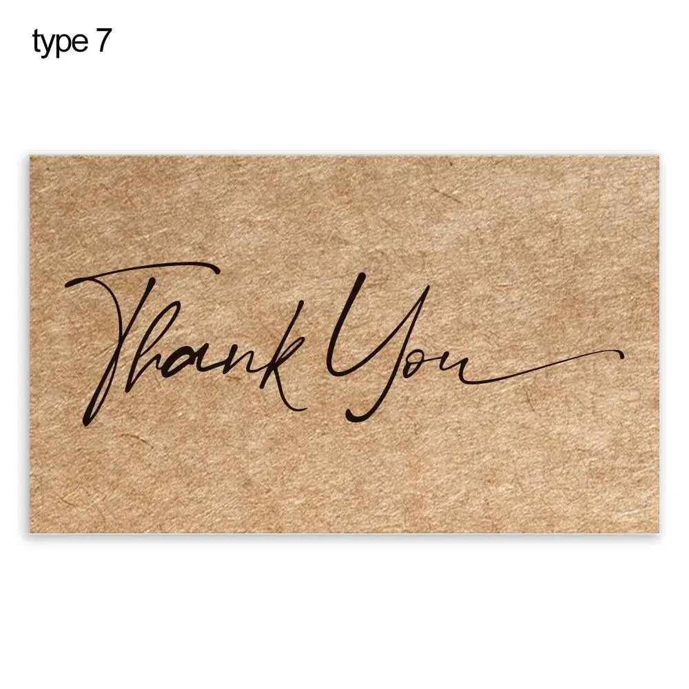 A brown kraft paper tag with the handwritten text Thank You