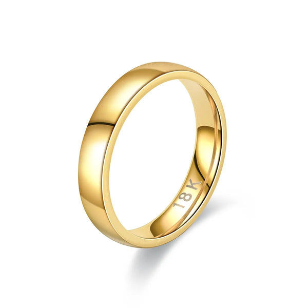 A close-up view of a polished 18k gold wedding band ring.