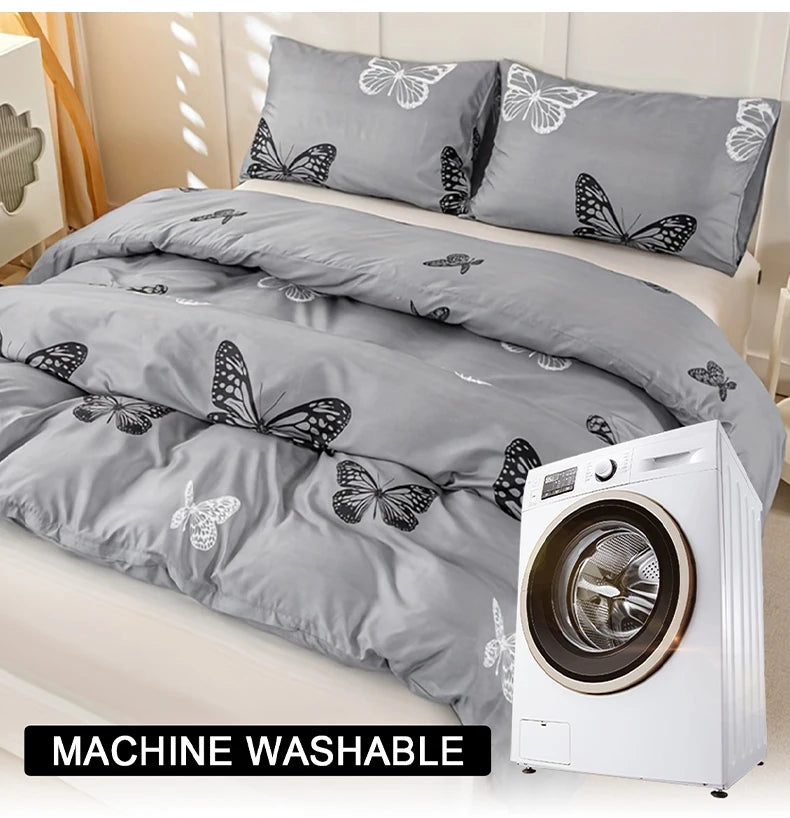 A gray duvet cover set with a butterfly print is displayed next to a white washing machine.