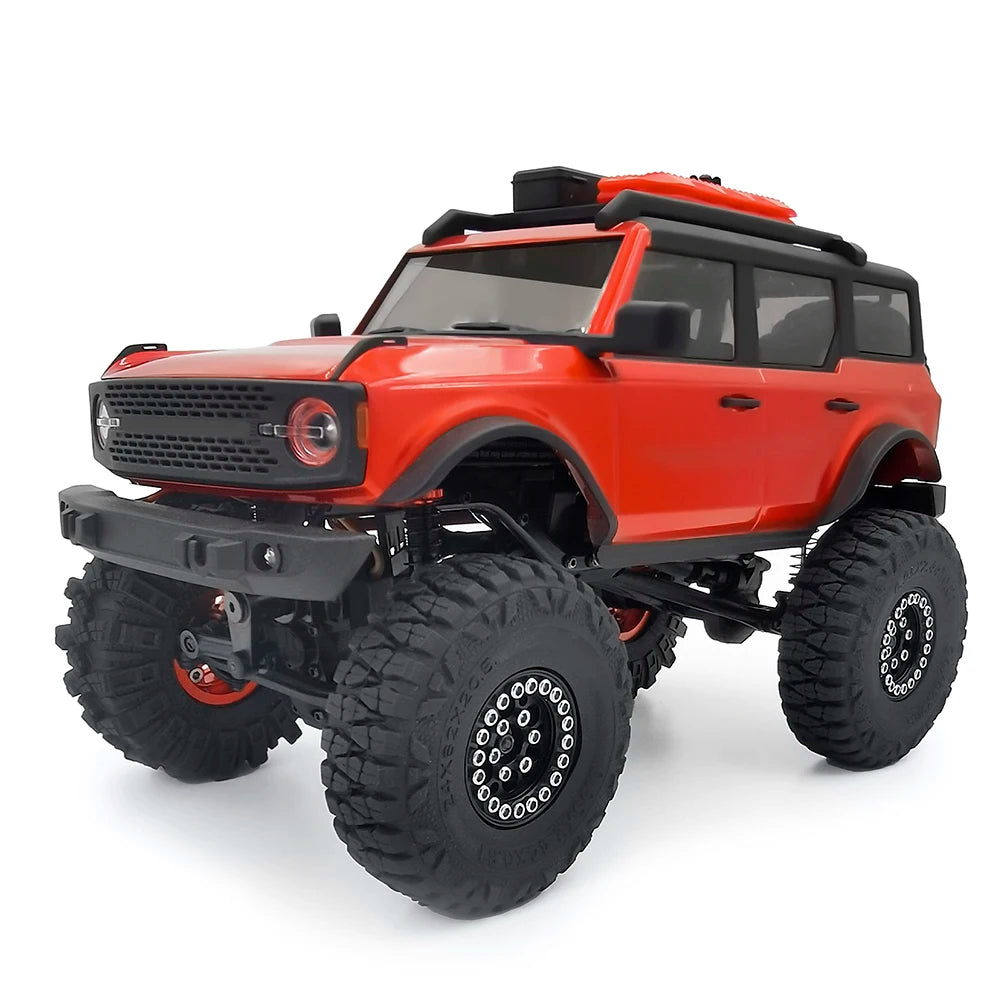 Red RC truck with rubber mud terrain tires and black accents.