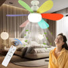 A woman smiling while a multi-colored LED ceiling fan light hangs above her bedroom.