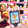 A pink unicorn smart phone toy with dual cameras and music player is shown next to a smiling girl holding a gift.