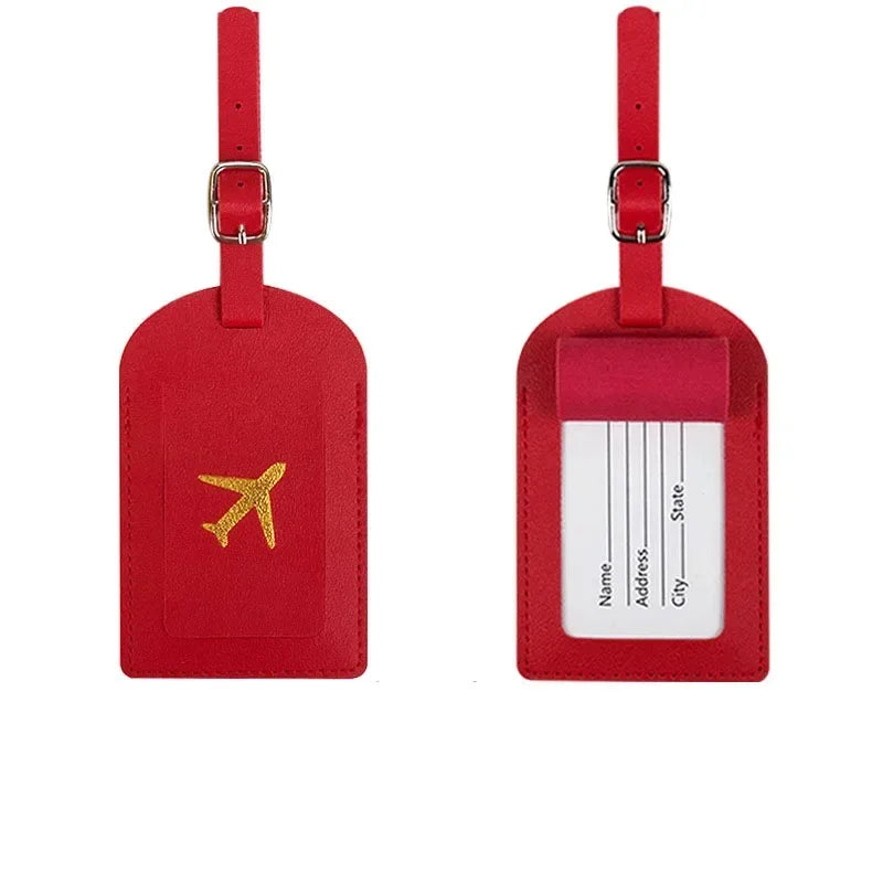 A red PU leather luggage tag with a gold airplane design and a white address section.