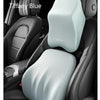 A light blue memory foam car headrest pillow with shoulder support placed on a black car seat.