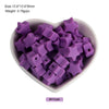 A pile of purple silicone crown star heart beads for DIY jewelry making