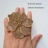 A hand holds a yellow rhinestone flower sew-on patch, measuring 8.5cm or 3.35 inches.