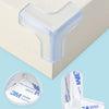 Clear silicone corner edge guard for baby safety, shown on a white surface and packaged.