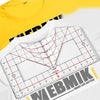 A white alignment ruler with red markings is shown next to a yellow t-shirt.