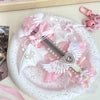 A pink and white utility cutter featuring a cat paw design with a replaceable blade and decorative elements.