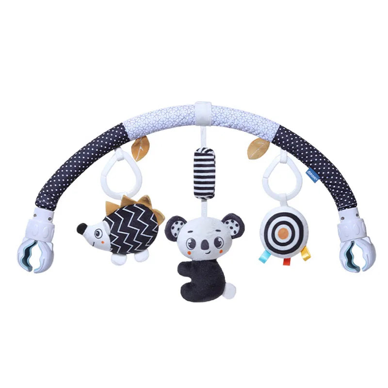 A baby stroller arch toy featuring a curved bar with hanging plush charms including a panda and a striped bead.