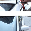 A hand is applying an automotive rubber sealing strip to a car window frame for noise and weather protection.