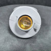 A white E27 screw cap light bulb holder with a brass-colored socket is shown on a gray surface.