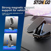 A black magnetic phone mount with adjustable pitch and height is shown mounted on a car window.