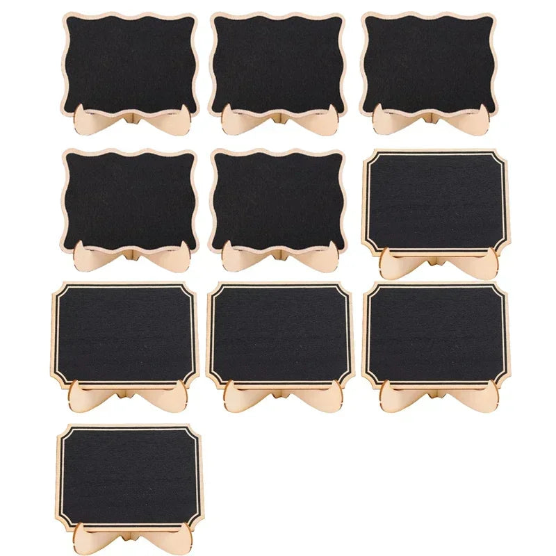 A set of ten mini wooden chalkboard signs in black with gold trim and decorative edges.