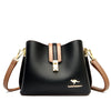 Black leather shoulder bag with gold hardware and brown strap