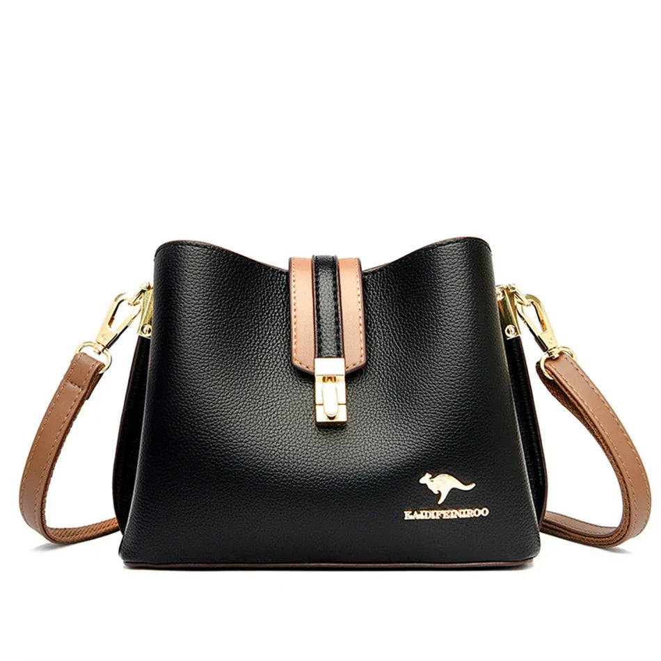 Black leather shoulder bag with gold hardware and brown strap