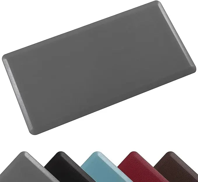 A gray anti-fatigue standing mat with a waterproof non-slip surface shown from an angle.