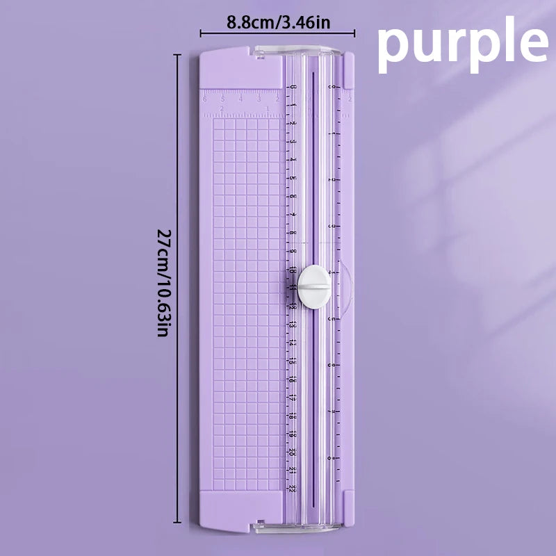 A purple A4 mini paper trimmer with a precision cutter and ruler markings.
