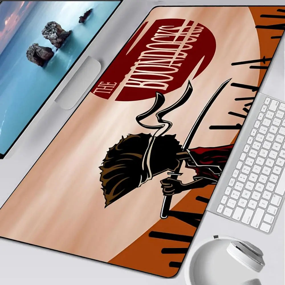 A large gaming mouse pad featuring a graphic of a character and text from The Boondocks