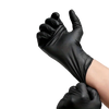 A hand wearing a black disposable nitrile glove is shown making a fist against a black background.