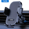 A black car phone mount with a textured surface and a TOPK logo, shown mounted on a car air vent.