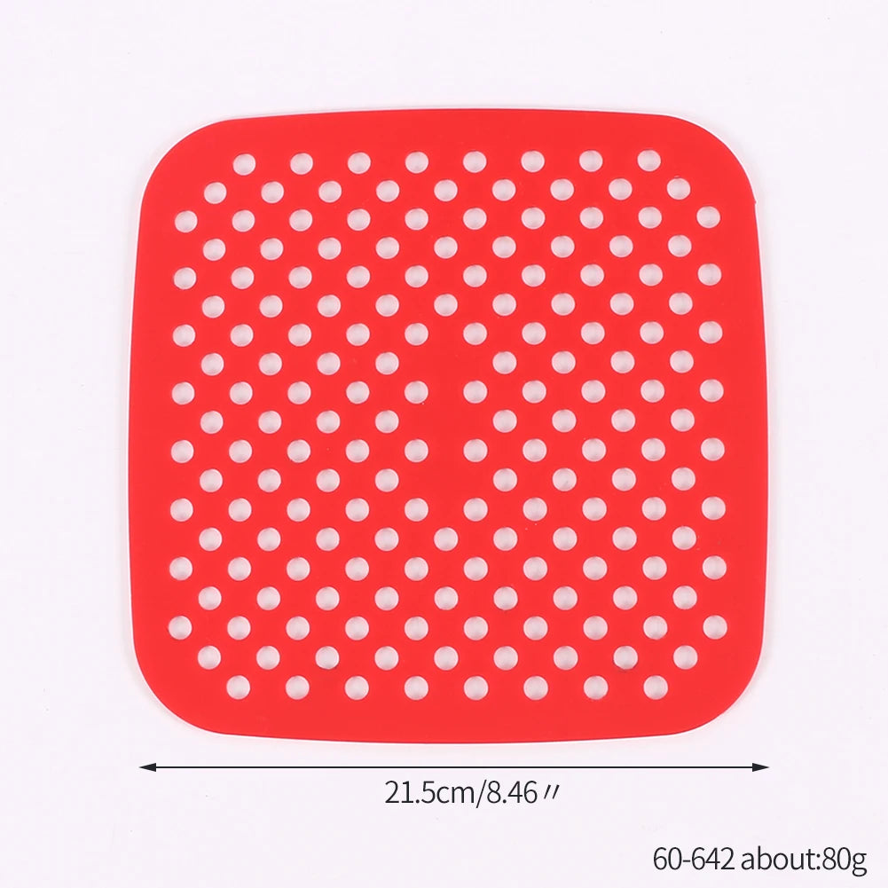 Red reusable silicone air fryer liner with a grid pattern