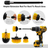 A set of three yellow and black scrubbing brushes and an extension rod for reaching hard-to-reach areas.