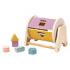 Wooden baby rattle bell with a soothing ring featuring purple and yellow colored blocks.