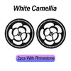 Two black non-slip coasters featuring a white camellia flower pattern and rhinestone accents.