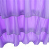 Purple sheer fabric bed skirt with ruffled hem, designed to wrap around a mattress.