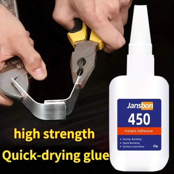 Una mano está aplicando un tubo de pegamento instantáneo Jansbon 450 a una superficie.