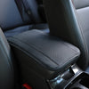 Black PU car armrest cover with a textured storage pad and storage compartment visible in the interior.
