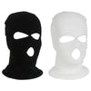 A pair of black and white ski mask car headrest covers.