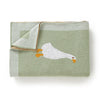 A soft cotton baby swaddle blanket in sage green with a white cartoon chicken print.