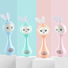 Four musical rabbit baby rattle and teether toys in light blue, mint green, peach, and pink colors
