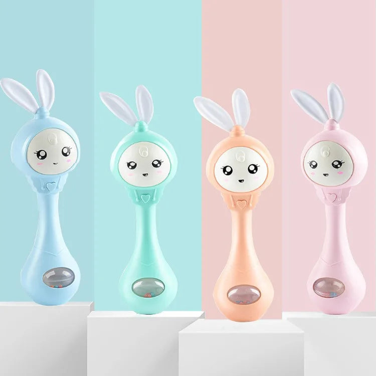 Four musical rabbit baby rattle and teether toys in light blue, mint green, peach, and pink colors