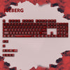A close-up view of a red mechanical keyboard featuring an Iceberg theme and keycaps.