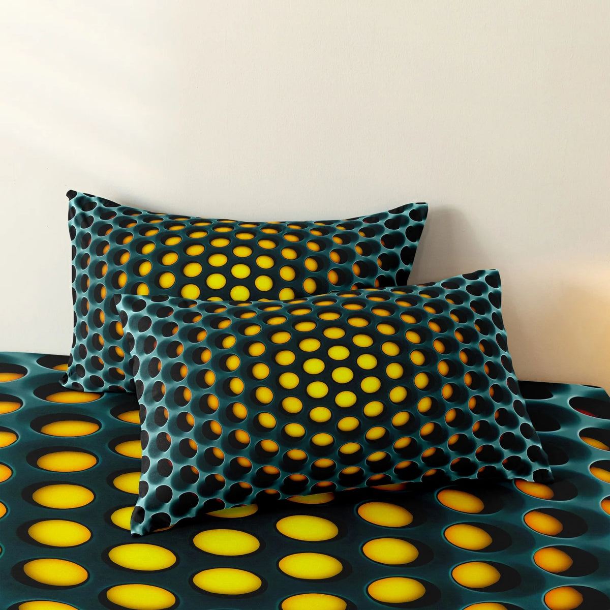 A close-up of a teal and black geometric duvet cover set featuring a pattern of yellow circles on a bed.